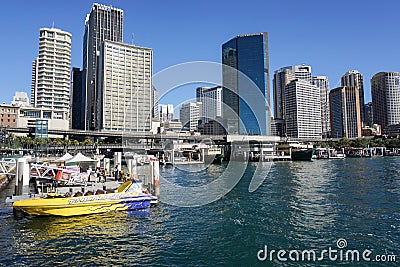 People with yellow passenger speed boat at harbour Editorial Stock Photo