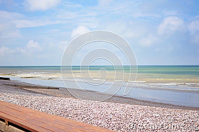 Peppel beach and teal ocean in Seine Maritime department in the Normandy region of northern France Stock Photo