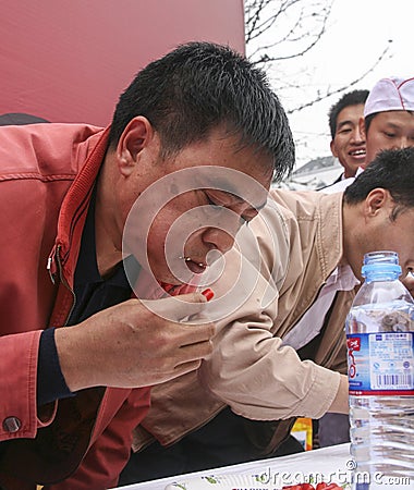 Pepper eating competition in chengdu,china Editorial Stock Photo