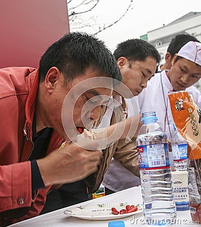 Pepper eating competition in chengdu, china Editorial Stock Photo