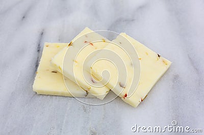 Pepper jack cheese on a marble cutting board Stock Photo