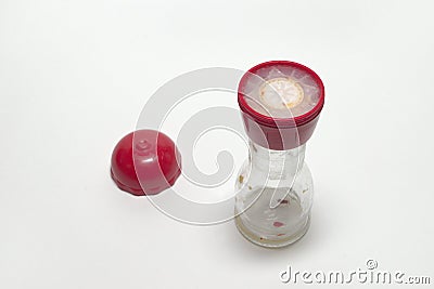 Empty glass pepper mill with two degrees of grind, with the red Stock Photo