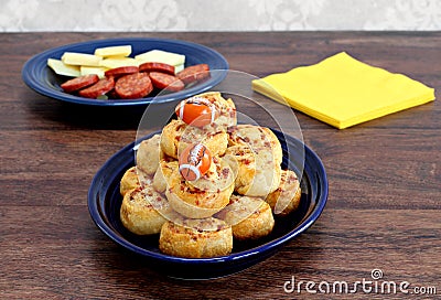 Pepperoni pinwheel snacks garnished with footballs. Stock Photo