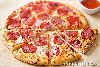 Pepperoni pizza with chilli dip Stock Photo