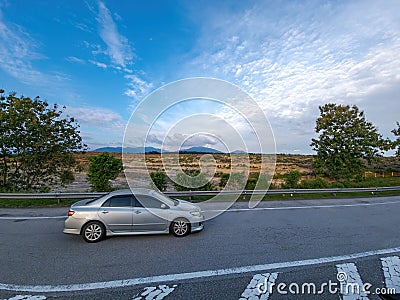 View at the highway, car moving next to the deforestation. Stock Photo