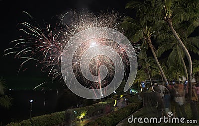 Slow exposure shots of the night scene where tourists gathered to watch the Christmas's eve firework Editorial Stock Photo