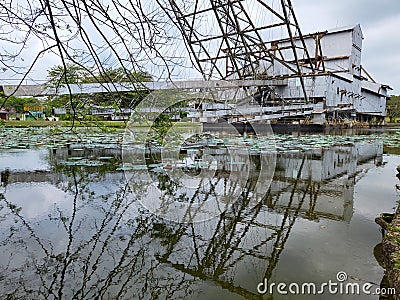 Exterior of old tin mining dredge converted into exhibition park in Tanjung Tualang, Perak. Editorial Stock Photo