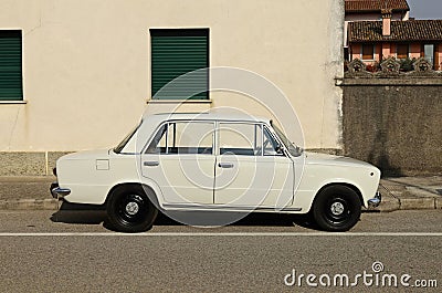 Vintage white Fiat 124 Special, family car from Sixties and Seventies, at the roadside. Editorial Stock Photo