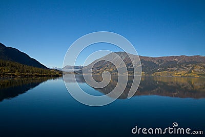 Perfect autumn lake reflection, Carcross, Yukon Stock Photo