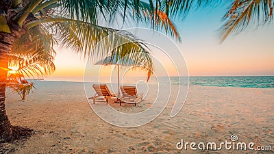 Beautiful Maldives island beach landscape. Chairs and umbrella for summer vacation and holiday background. Exotic tropical beach c Stock Photo