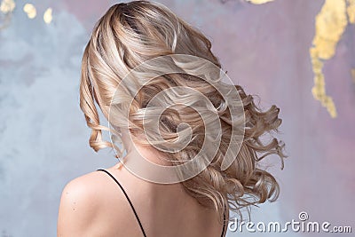 Perfect blonde, beautiful and well-groomed blonde hair. Long curls, Stock Photo