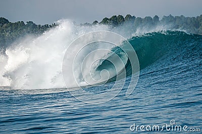 Perfect blue aquamarine wave, empty line up, perfect for surfing, clean water, Indian Ocean, Mentawai Stock Photo