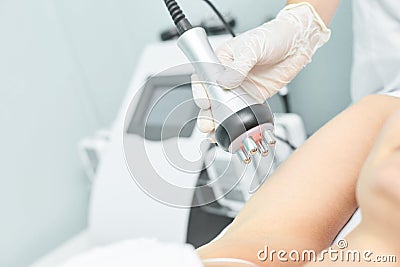 Perfect body radio treatment. Woman at spa procedure. Doctor hand and girl body. RF cosmetology lifting. Flabby hand Stock Photo