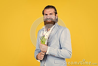 Perfect day. floral gift for mothers or womens day. happy man with tulip flowers. gentleman hold flower bouquet. concept Stock Photo