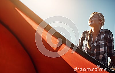 The perfect day for an outdoorsy person. an attractive young woman spending a day kayaking on the lake. Stock Photo
