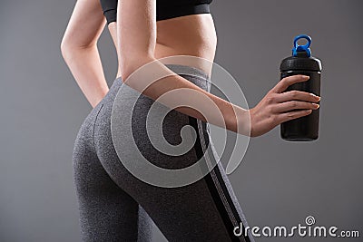 Perfect female body shape after fitness and sport protein food drinks. Stock Photo