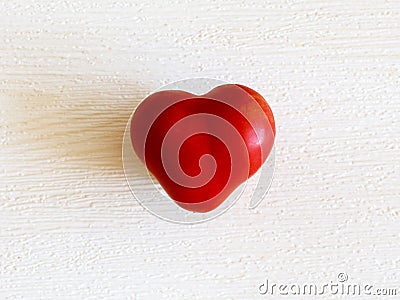 Perfect heart shaped organic tomato on white background. healthy heart, diet, love concept Stock Photo
