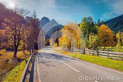 Perfect morning view of mountain peak with asphalt road. Stock Photo