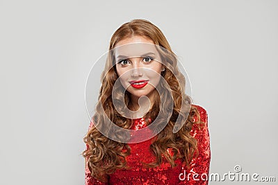 Perfect redhead woman model with curly hair and red lips makeup on white background Stock Photo