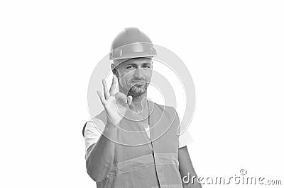 Perfect repairing guaranteed. man in helmet show ok gesture. successful worker in hardhat. wear hard hat to protect Stock Photo