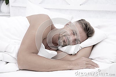 Perfect rest. Sleeping beauty. Man handsome guy lay in bed. Get enough amount of sleep every night. Tips sleeping better Stock Photo