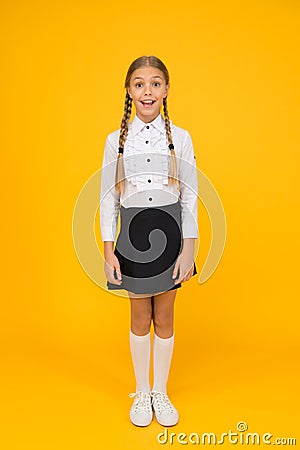 Perfect schoolgirl. Small schoolgirl with happy smile. Little schoolgirl looking nice in school uniform. Cute schoolgirl Stock Photo