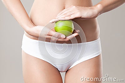 Perfect Slim Woman Body and apple. Diet Concept Stock Photo