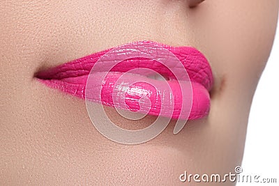 Perfect smile. Beautiful full pink lips and white teeth. Pink lipstick. Gloss lips. Make-up & Cosmetics Stock Photo