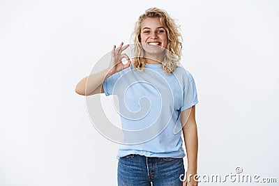 Perfect, totally love it. Happy and pleased delighted female customer with blond short hairstyle and satisfied joyful Stock Photo