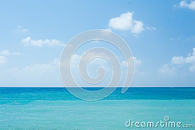 Perfect tropical white sandy beach and turquoise clear ocean water - summer vacation natural background with blue sunny sky Stock Photo