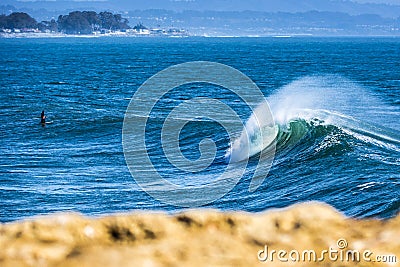 Perfect wave breaking in south Santa Cruz in California. Stock Photo