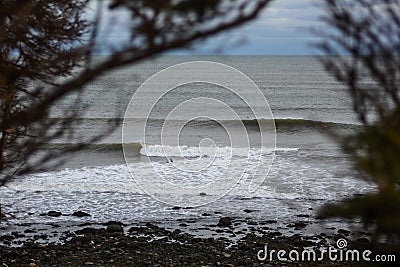 Perfect wave on a cloudy day Stock Photo