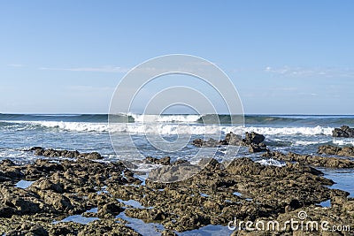 Perfect wave hover the rocks Stock Photo