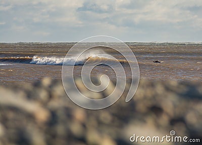 Perfect wave on a sunny day with foreground background bohkeh Stock Photo