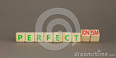 Perfectionism symbol. Concept words Perfect or Perfectionism beautiful wooden blocks. Beautiful grey table grey background. Stock Photo