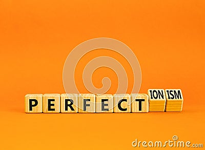 Perfectionism symbol. Concept words Perfect or Perfectionism beautiful wooden blocks. Beautiful orange table orange background. Stock Photo