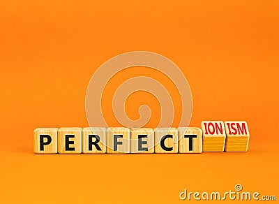 Perfectionism symbol. Concept words Perfect or Perfectionism beautiful wooden blocks. Beautiful orange table orange background. Stock Photo