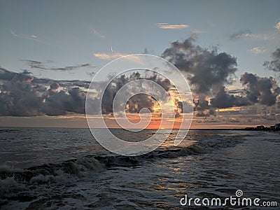 Perfectly timed beach sunset Stock Photo