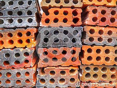 Perforated bricks piles with core holes Stock Photo