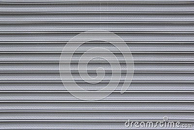 Perforated metal security shutter background Stock Photo