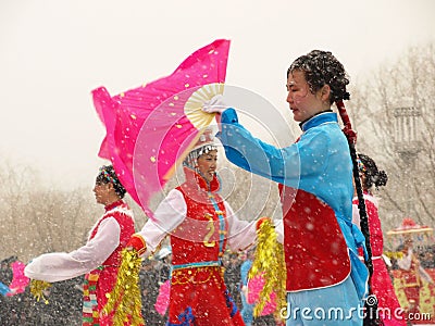 Perform traditional dance Yangge in the snow Editorial Stock Photo