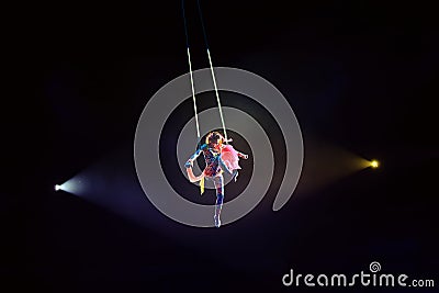 Performance of the girl aerial acrobat in the circus Stock Photo