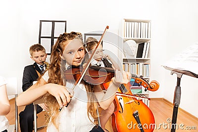 Performance of kids playing musical instruments Stock Photo