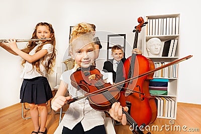 Performance of kids who play musical instruments Stock Photo