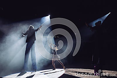 The performance of stilt-walkers in the circus Stock Photo