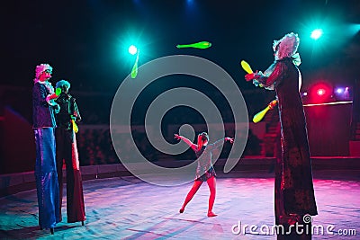 The performance of stilt-walkers in the circus Stock Photo