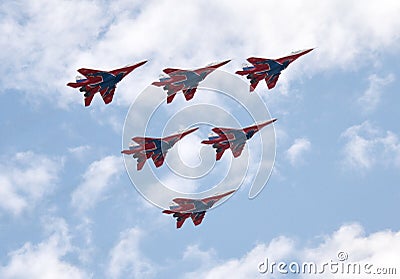 Performance of the Swifts aerobatic team on multi-purpose highly maneuverable MiG-29 fighters over the Myachkovo airfield Editorial Stock Photo