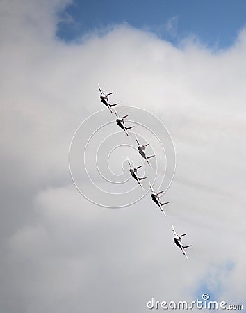 Performance of the Swifts aerobatic team on multi-purpose highly maneuverable MiG-29 fighters over the Myachkovo airfield Editorial Stock Photo