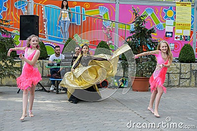 Performance of young dancers. A group of young dancers in public. Dancing in the open air. Rising young dancers. The kids dance Editorial Stock Photo