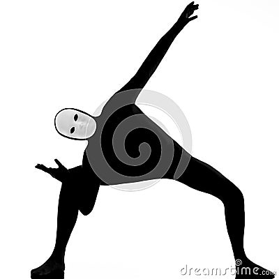 Performer mime with mask stretching flexibility Stock Photo